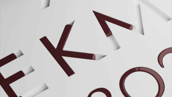 The filled letterforms seen at an angle, chocolate set and glossy.