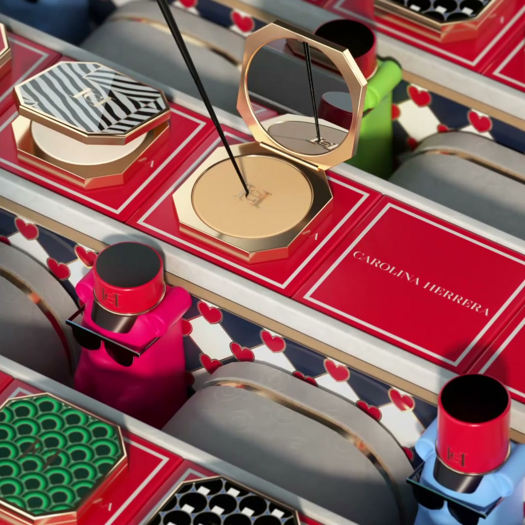 A production line of gold compacts and lipstick bullets on red and navy belts, branded Carolina Herrera.