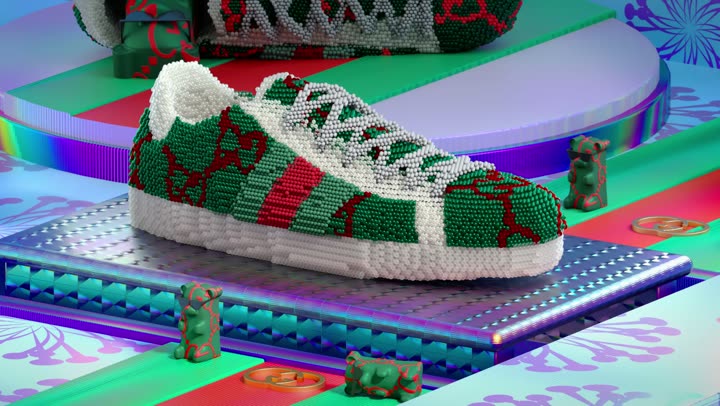 The knitted Ace sneaker entering frame on the conveyor.