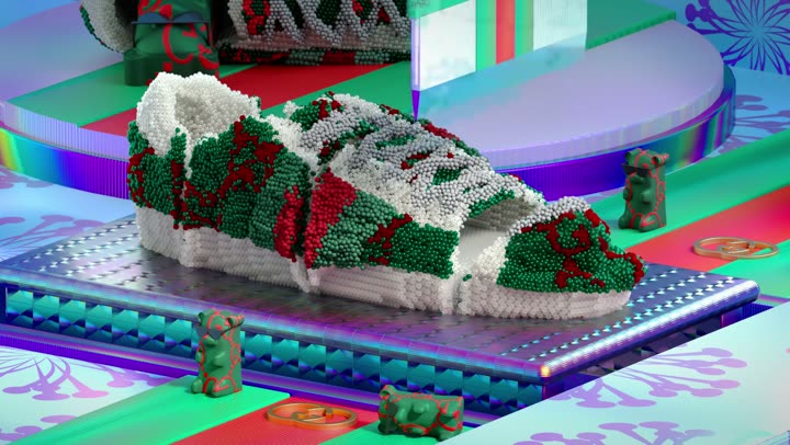The sneaker passing out of frame, the purple platform behind it.