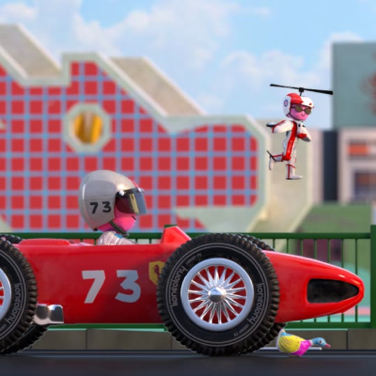 A driver in a silver helmet at the wheel of a red number 73 racing car, a small figure flying overhead on a rotor.