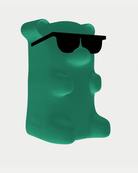 A green gummy bear wearing sunglasses, modelled in 3D.